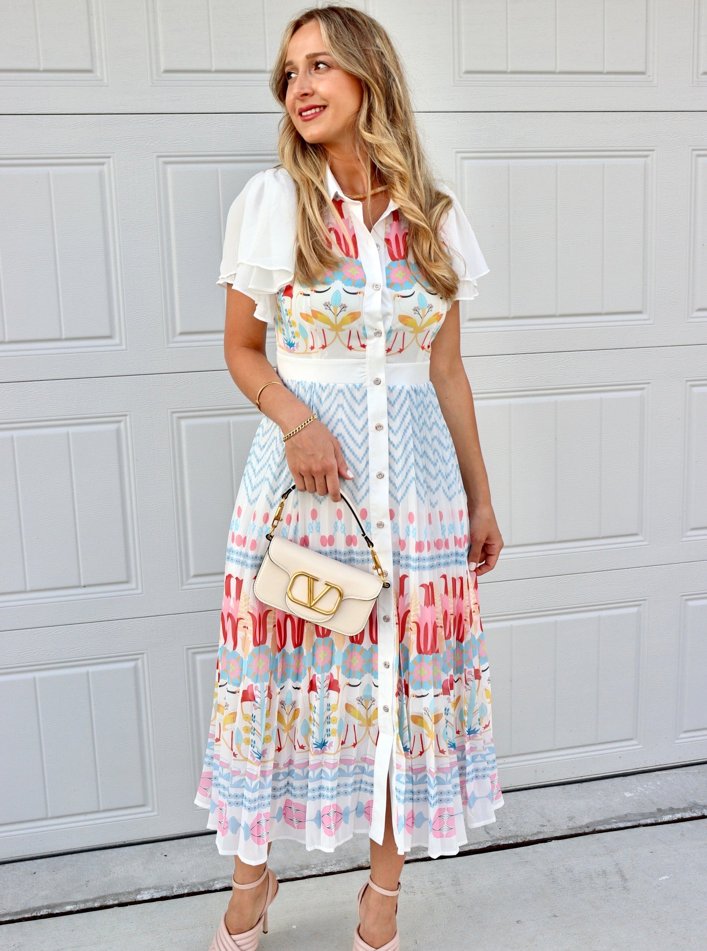 Feminine styling with the Rio multi colors pink red yellow blue buttons puff  Dress!  - True to size  - Light and Airy  - Material: 55% polyester 45% cotton