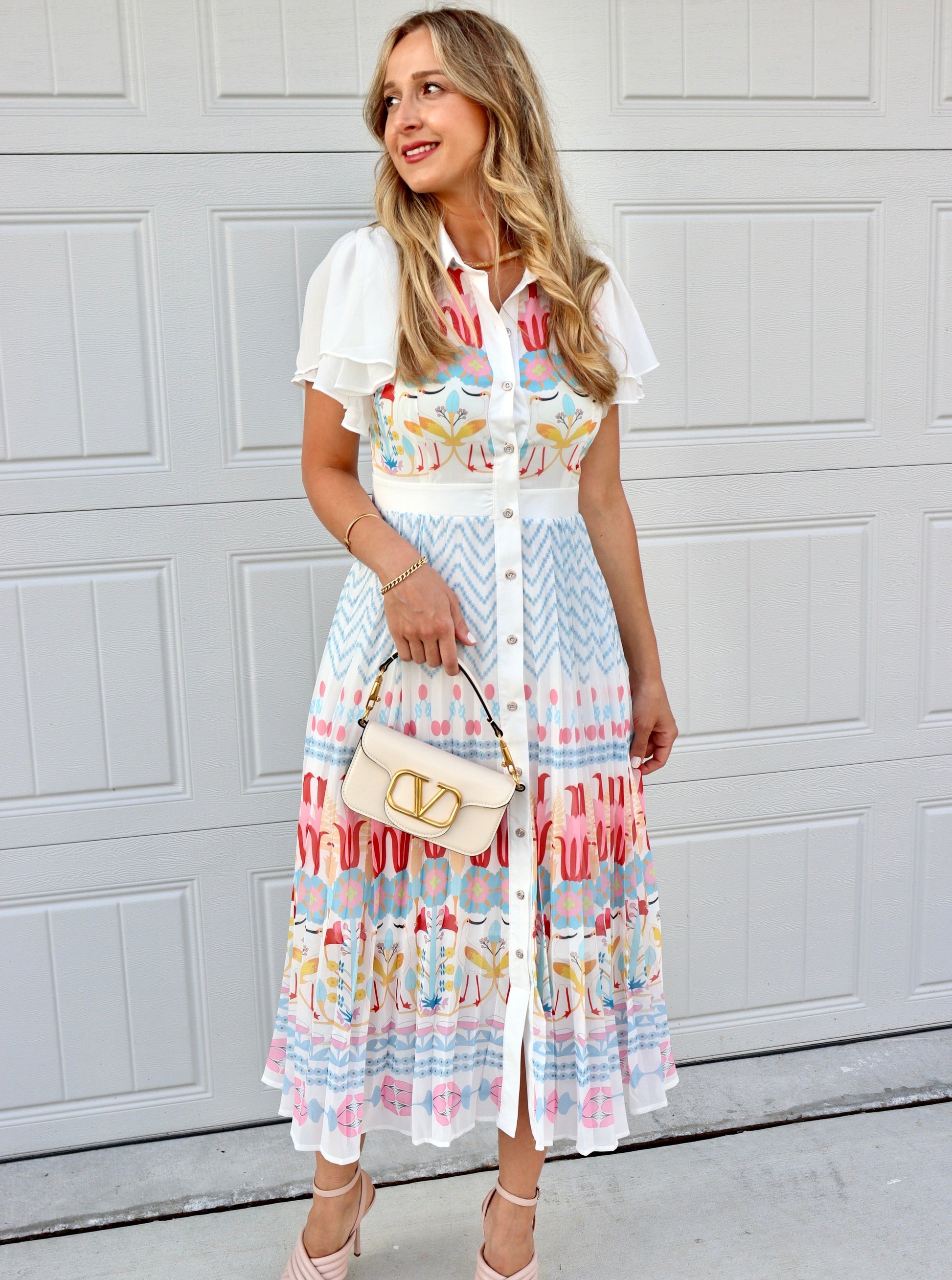 Feminine styling with the Rio multi colors pink red yellow blue buttons puff  Dress!  - True to size  - Light and Airy  - Material: 55% polyester 45% cotton