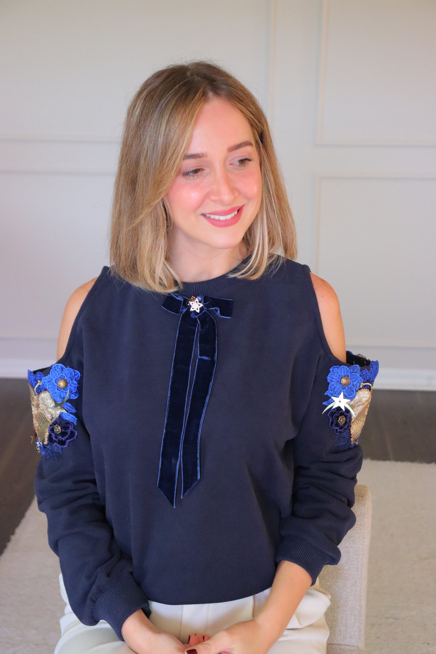 Cold shoulder flower embellished sweater- Velvet Bow