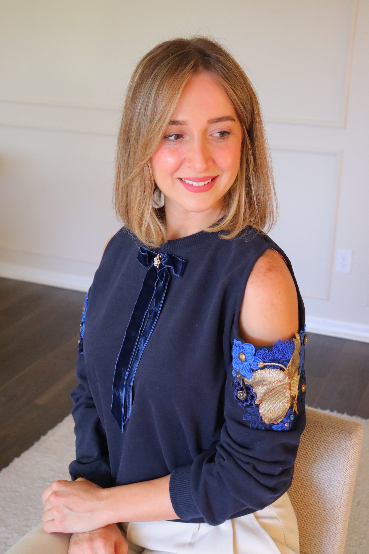 Cold shoulder flower embellished sweater- Velvet Bow