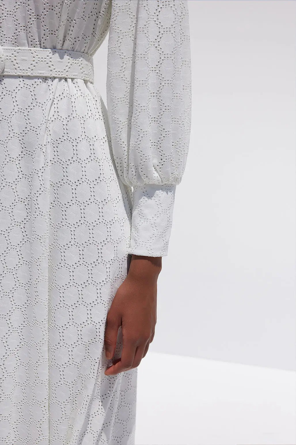 Feminine styling with the Oslo white patterns Dress!  - Cuff with zipper - Belt included - Puff Sleeve and a swingy pleated skirt - Material : Cotton/ Flat cut