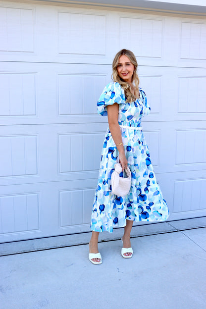 Feminine styling with the Sequoia Blue circles Dress!  - Elastic Neckline - Elastic Waistline - Material Polyester/ Rayon - Puff Sleeve